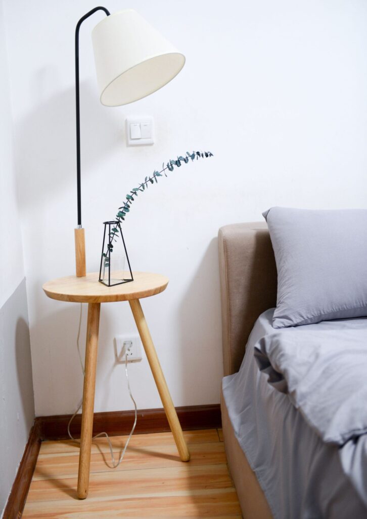 engineered-wood-flooring-Ireland White Shade Table Lamp Near Bed