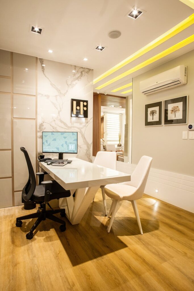 engineered-wood-flooring-near-me Turned-on Black Flat Screen Monitor on White Wooden Table and Chairs